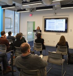 Amy Whitesides presents to an audience of her cohort members and guest advisors