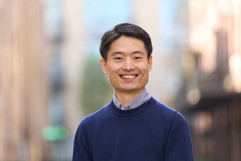 A photograph of Yoshihiko Kubota smiling. 