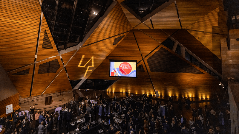 Looking down on the sizable crowd below the angular, wood-paneled walls of the venue