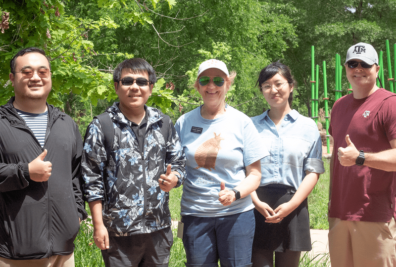 The Texas A&M research team gives a thumbs up.